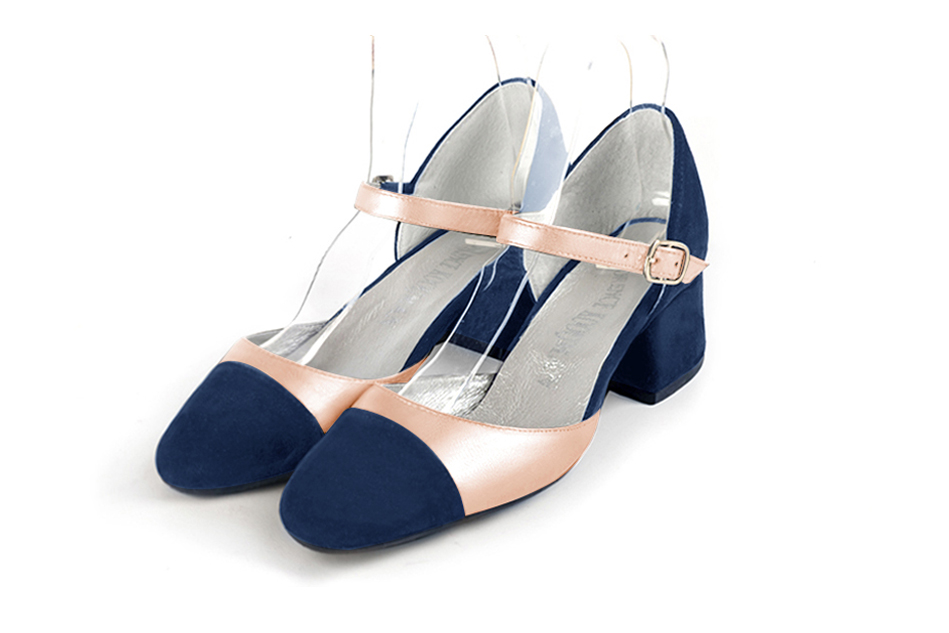 Navy blue and powder pink open side elegant shoes, with an instep strap. Round toe. Low flare heels.